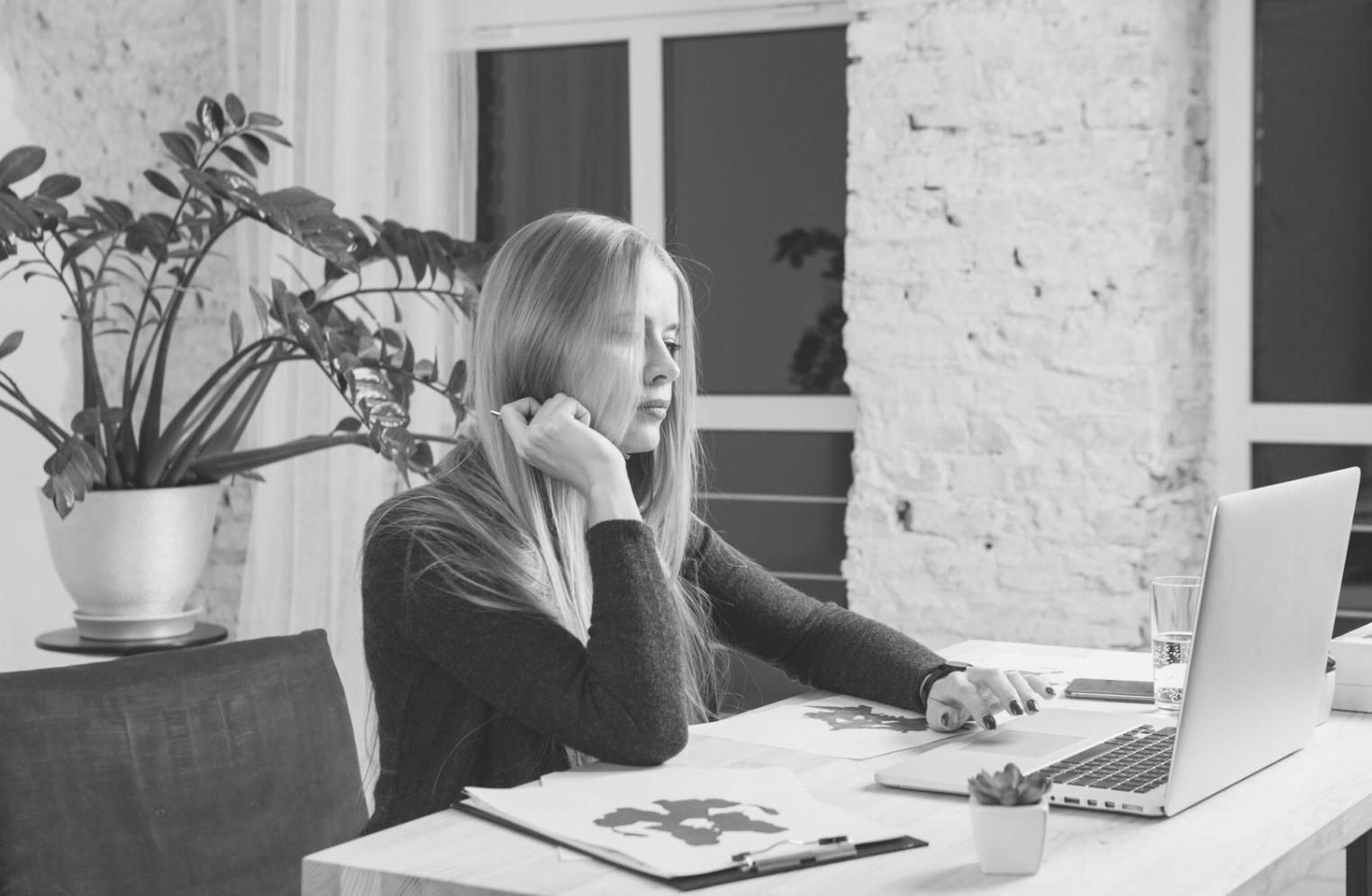 Students discussing investment strategies in small group setting